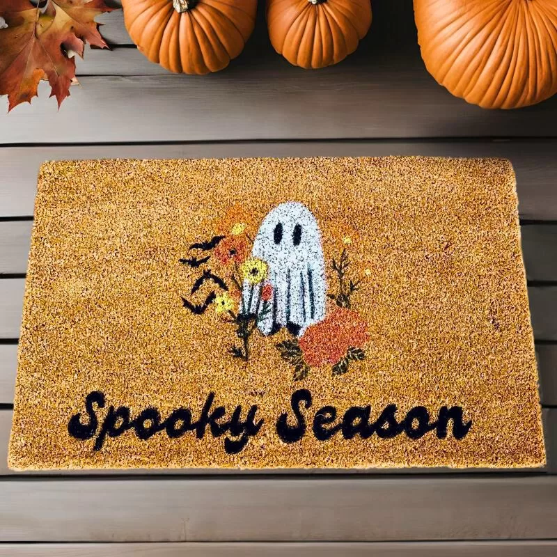 spooky season diy coir mat on porch with fall decorations